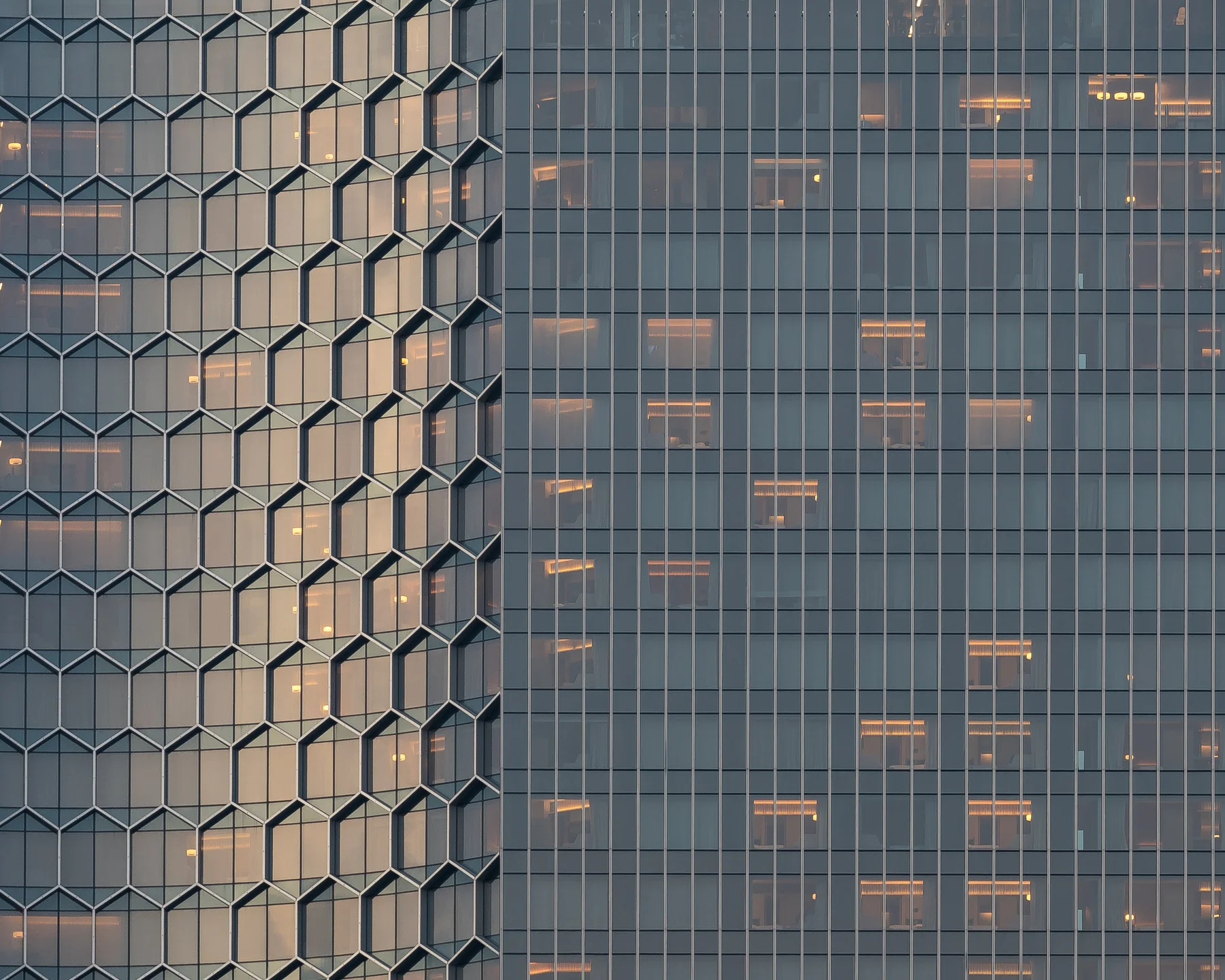 Sunset light across the honeycomb glass facade of Andaz Singapore