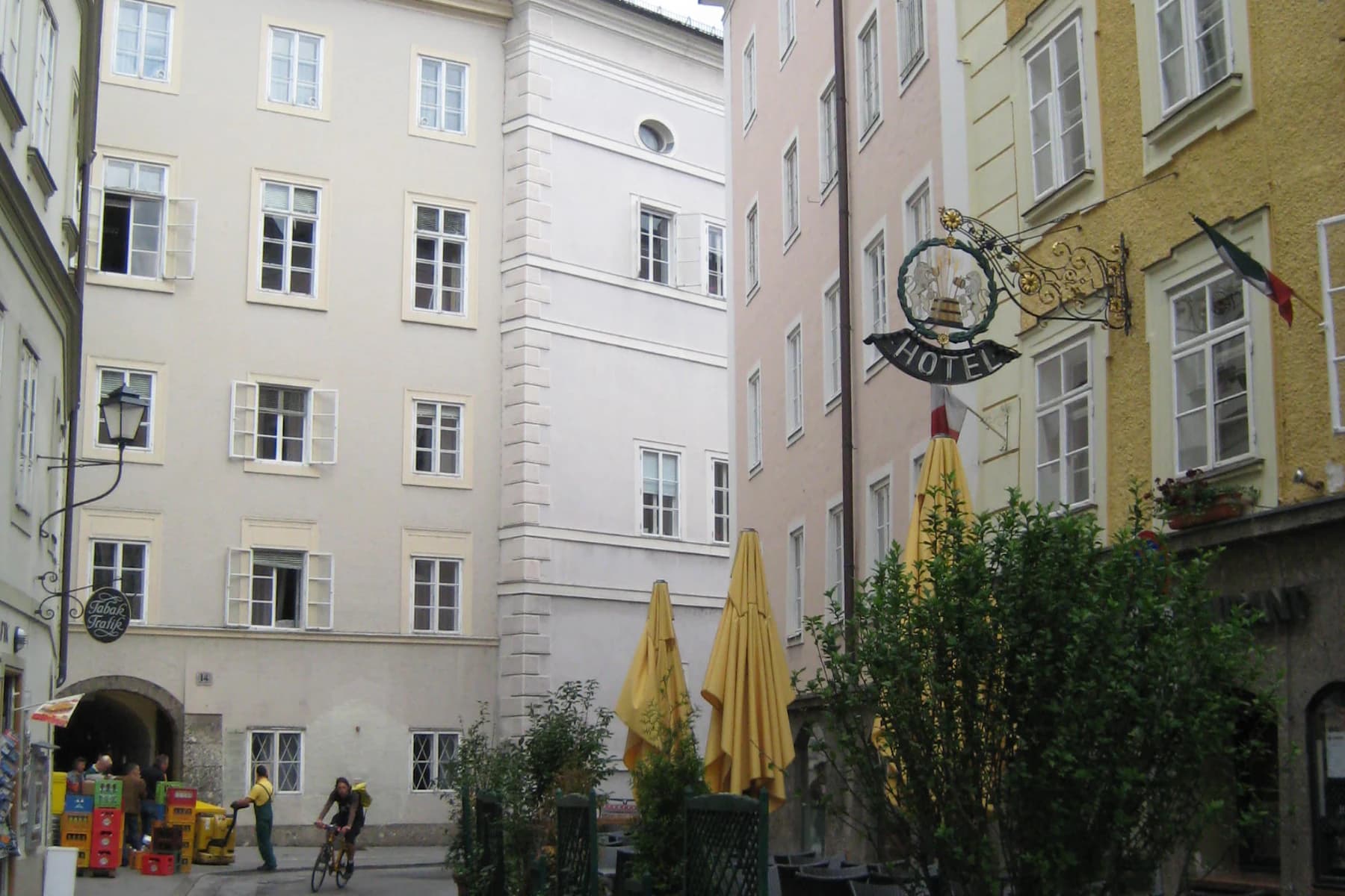 A quiet European street lined with traditional buildings