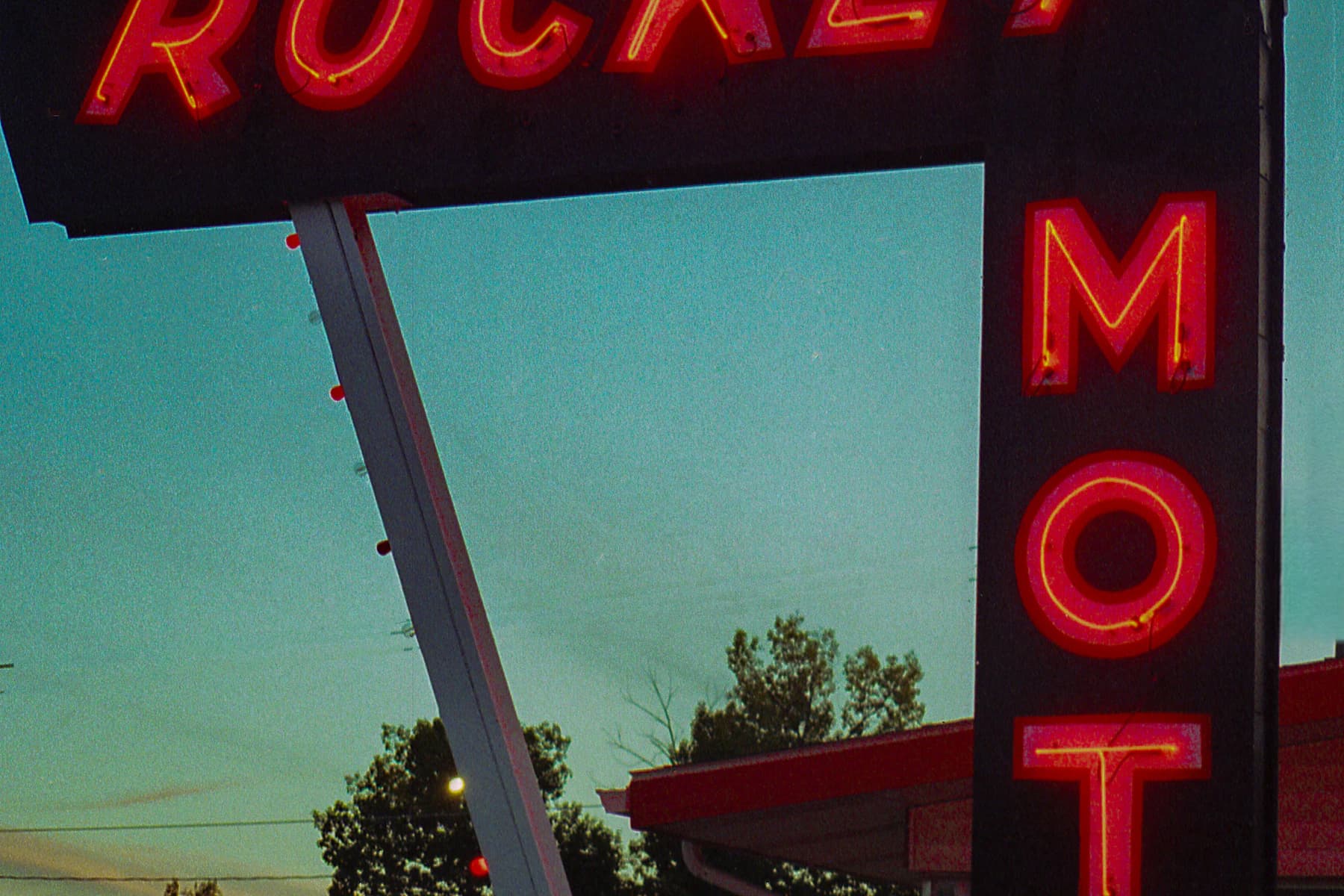 Neon motel sign glowing after dark