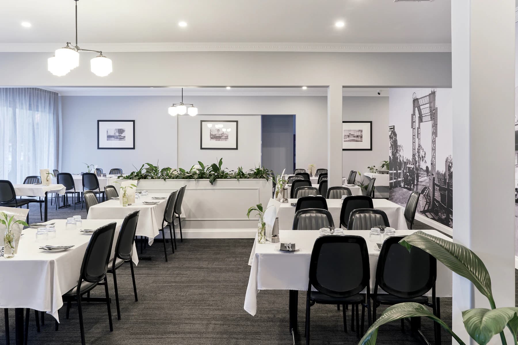 A contemporary hotel meeting room with a long table