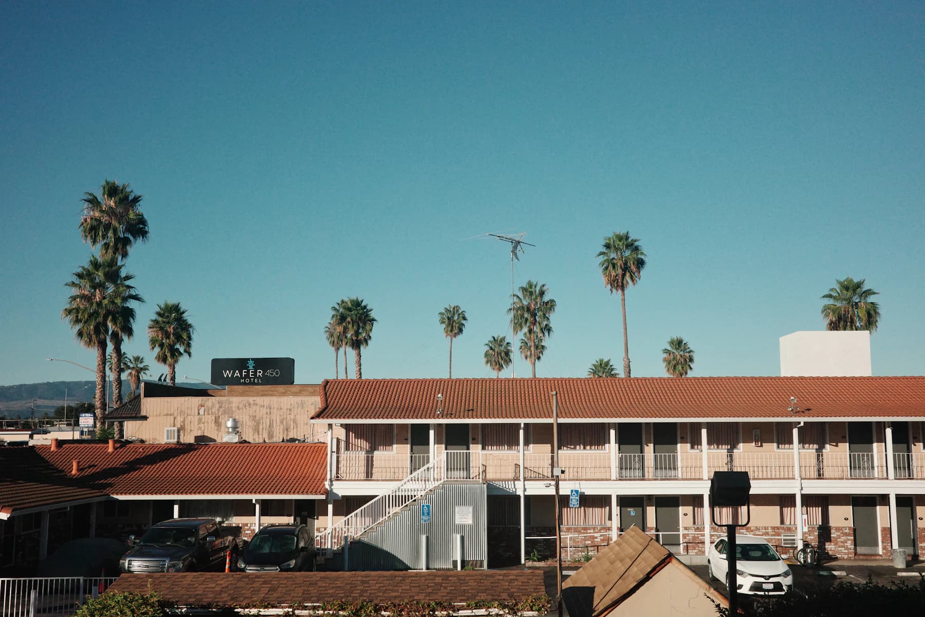 A low-rise roadside motel beneath an open sky
