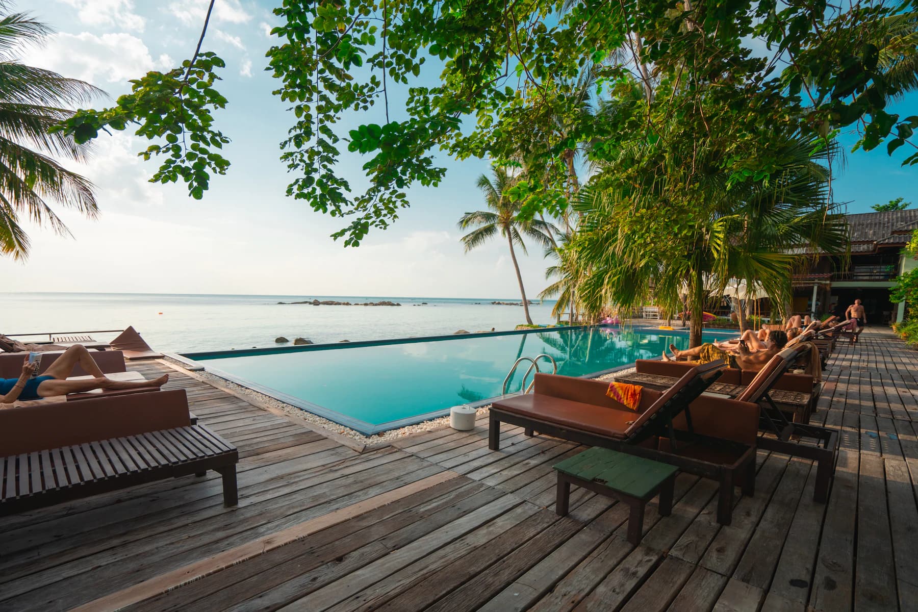 Sunlit resort terrace overlooking the sea