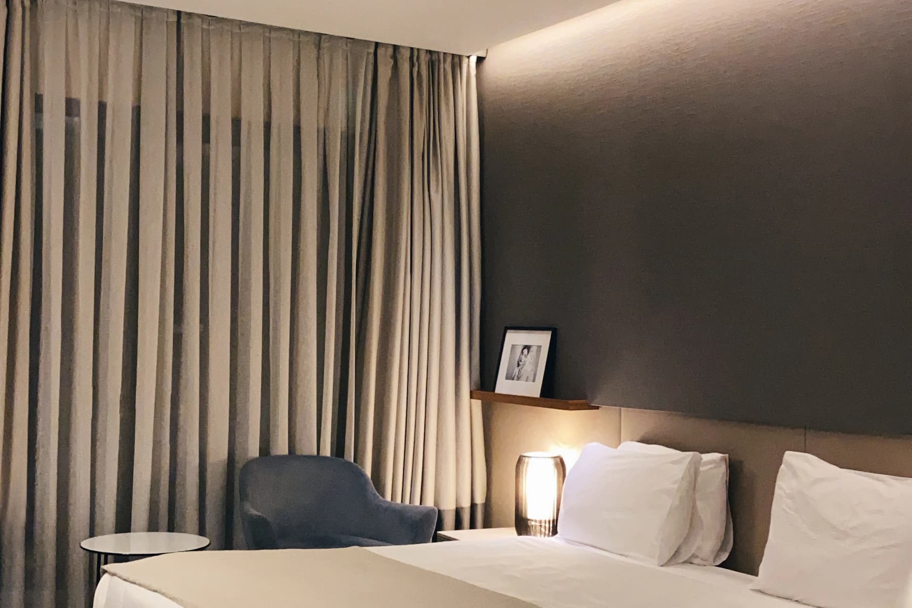 Quiet modern hotel bedroom with soft neutral colors
